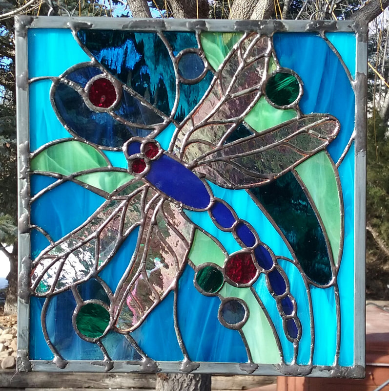 geometric stained glass dragon fly